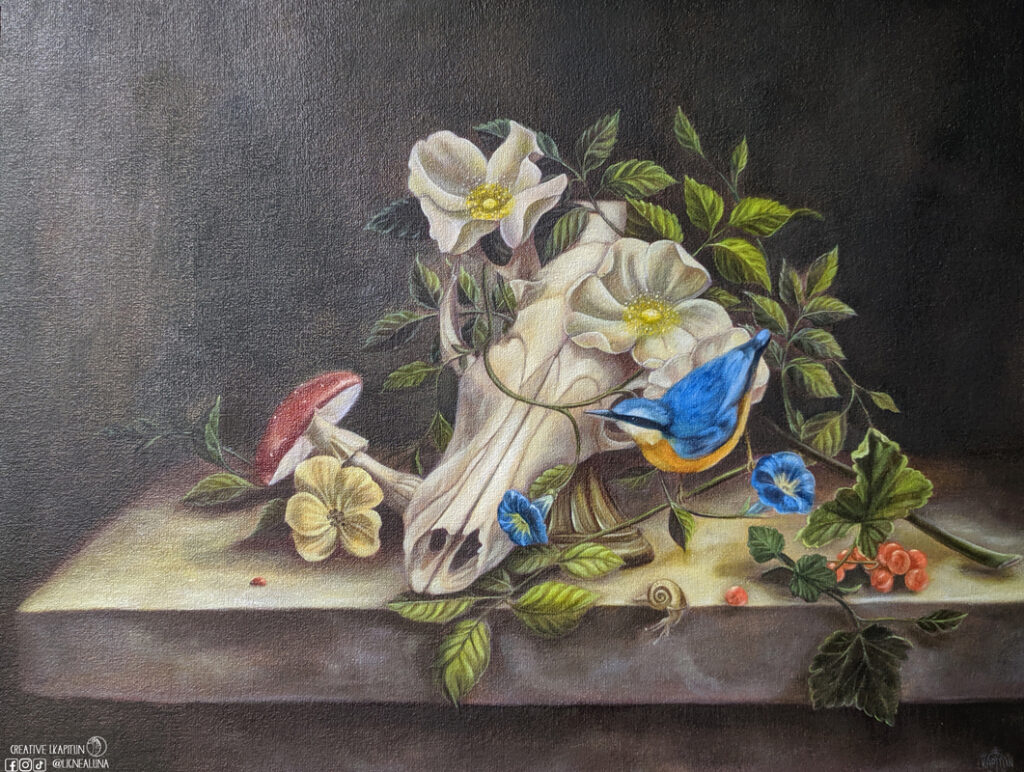 a fox skull with an nuthatch and a fly agaric